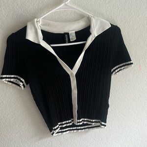 An H&M black and white button up shirt with a collar
